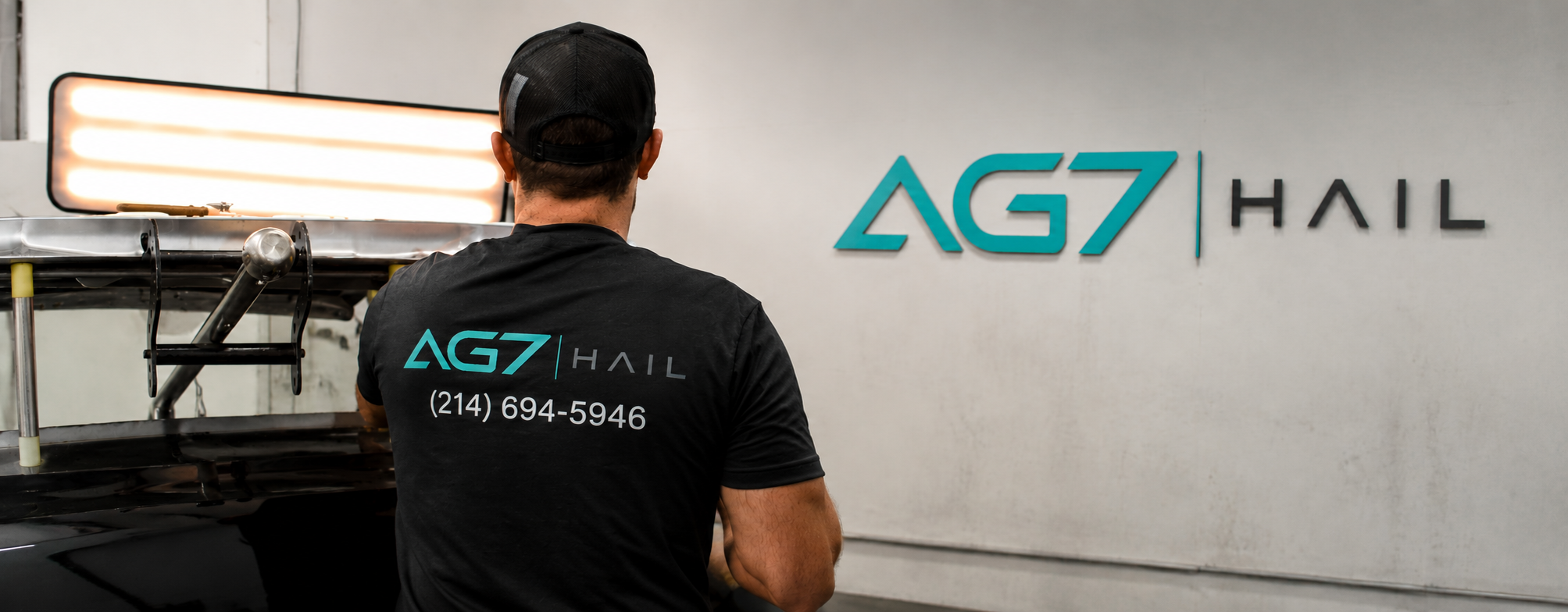 A vehicle being restored after hail damage by AG7 Hail technicians